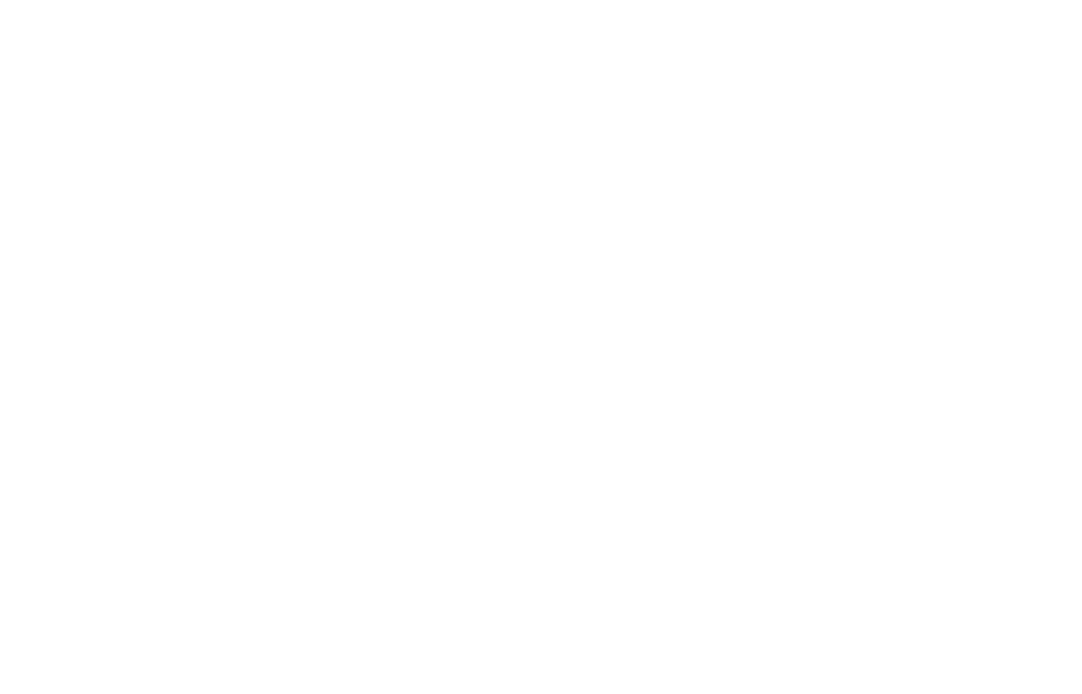 Genesis Builders logo with “Genesis Builders” in dark serif lettering and a stylized tree forming above the “i” in “Genesis.” The tree features a dark trunk and branches with circular leaves in varying green shades on a light background.